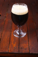 Dark beer on wood
