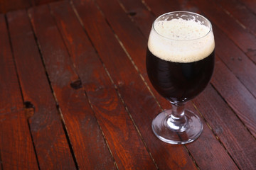 Dark beer on wood