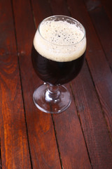 Dark beer on wood