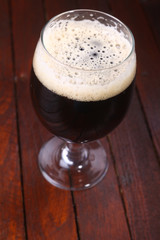 Dark beer on wood