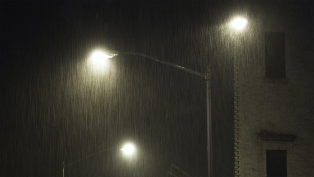 MS Illuminated street light in rain at night, New York City, New York, USA