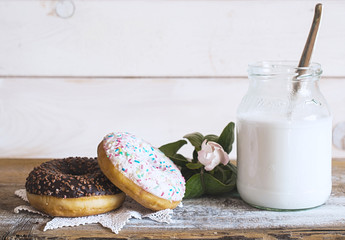 Donuts, milk and quince flower