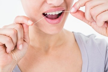 Woman using dental floss