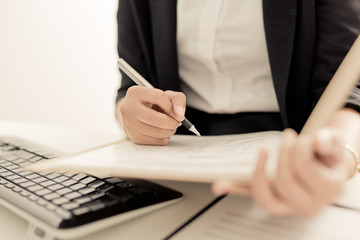 Fototapeta premium Young business woman working at office