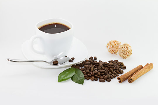 coffee in white cup and coffee beans