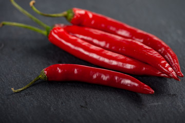 Burning hot vibrant red mexican chilli peppers