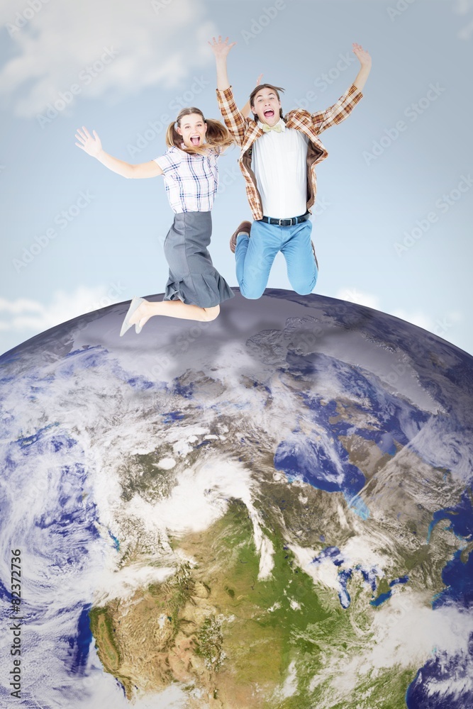 Poster Composite image of geeky hipsters jumping and smiling