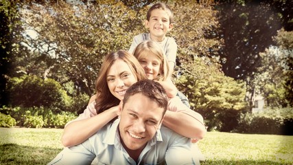 Happy family members lying on each other