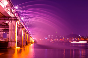 Fototapeta na wymiar Rainbow fountain show at Banpo Bridge in Seoul, South Korea.