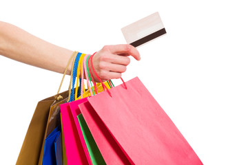 Woman hand with shopping bags and credit card