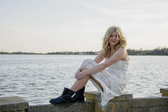 Blond woman in white lace dress