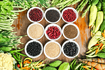 Muticoloured bean with fresh vegetables on the tables