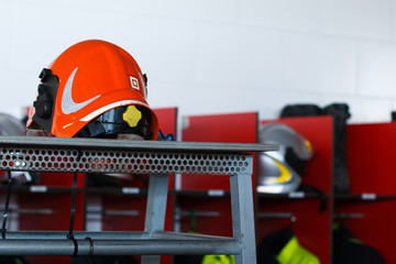 Fototapeta premium firefighter helmet near lockers