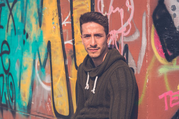 Young  man posing in an urban context