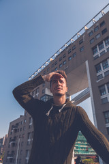Young  man posing in an urban context