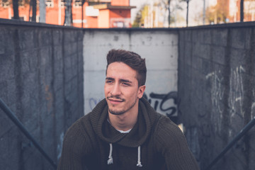 Young  man posing in an urban context