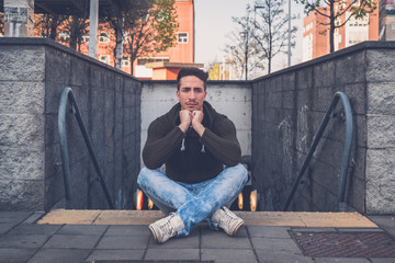 Young  man posing in an urban context