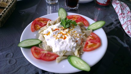 Turkish dumplings in yogurt sauce