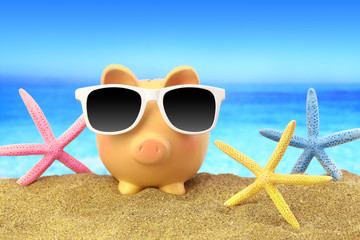 Summer piggy bank with sunglasses and starfishes on beach - Powered by Adobe