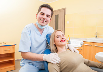 Dentist doctor and patient smiling