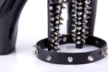 Close-up shot of black high heel shoes with spikes