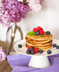 Stack of pancakes with fresh berries
