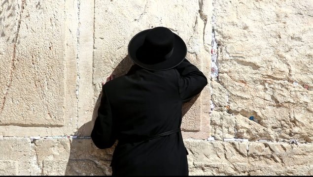 A man prays at the Western Wall, Jerusalem
