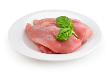 Raw fresh chicken fillet on white plate. With clipping path.