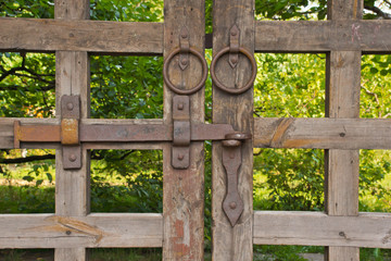 wooden gate among the foliage in the park