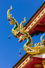 Fototapeta na wymiar Naga Lanna Gable apex with blue sky