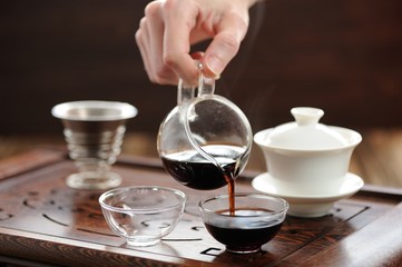 China tea ceremony with puerh tea brewing in haiwan