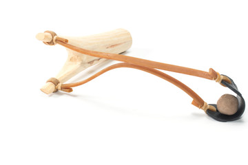 Wooden catapult slingshot isolated on white background