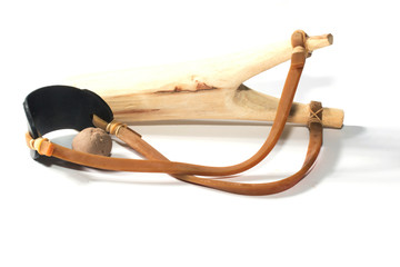 Wooden catapult slingshot isolated on white background
