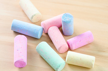 colorful chalk on wooden board