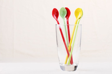 colorful spoon in clear glass