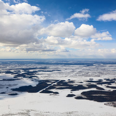 Top view of power line in forest tundra during winter