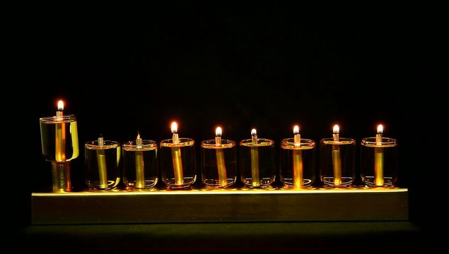 6 flames in Hanukia made of olive oil lanterns