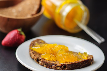 Sandwich with rye bread and orange jelly