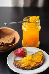 Sandwich with rye bread and orange jelly