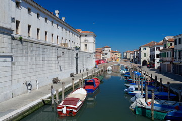Obraz na płótnie Canvas Canal at the old town of Chioggia - Italy.