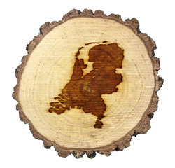 Slice of wood (shape of Netherlands branded onto) .(series)