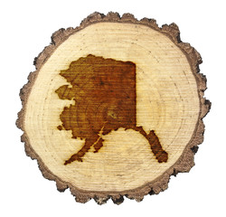 Slice of wood (shape of Alaska branded onto) .(series)