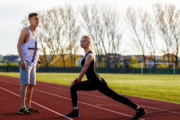 Obraz premium young health couple doing stretching exercise relaxing and warm