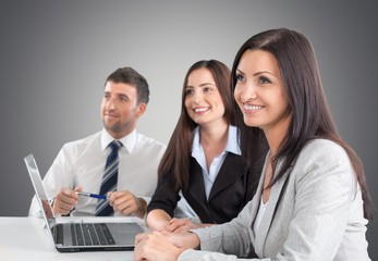 Business. Three business colleagues sitting together