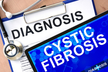 Form with word diagnosis and tablet with cystic fibrosis