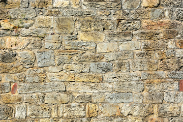 Stone wall in old village in Italy
