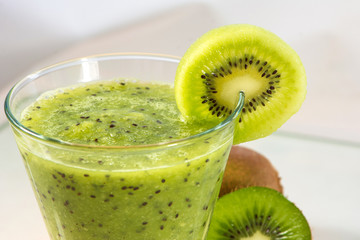 Fototapeta na wymiar Healthy fresh green kiwi smoothie