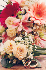 Wedding rings. Bridal bouquet of white flowers