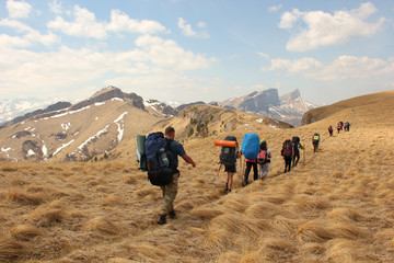 tourists hiking in the mountains
