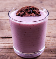 biscuits with yogurt on a wooden background